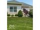 Charming backyard featuring lush lawn and mature landscaping at 3354 Nottinghill Dr, Plainfield, IN 46168