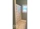 Bathroom featuring neutral tiling and a decorative shower curtain at 3354 Nottinghill Dr, Plainfield, IN 46168