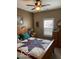Cozy bedroom with a wooden bed frame, quilt, and a bright window at 3354 Nottinghill Dr, Plainfield, IN 46168