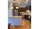 Modern kitchen with stainless steel appliances, wooden cabinets, and granite countertops at 3354 Nottinghill Dr, Plainfield, IN 46168