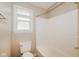 Clean bathroom featuring a shower-tub combination, and an updated toilet with a privacy window at 3626 N Capitol Ave, Indianapolis, IN 46208
