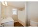 Bright bathroom with a shower/bathtub combo, a toilet, and a single sink vanity at 3626 N Capitol Ave, Indianapolis, IN 46208