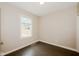 This bedroom features new flooring and a large bright window at 3626 N Capitol Ave, Indianapolis, IN 46208