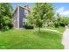 Charming two-story home with a lush green front yard and mature trees at 3626 N Capitol Ave, Indianapolis, IN 46208