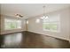 Bright and open living area featuring stylish vinyl flooring, contemporary chandelier, and ample natural light at 3626 N Capitol Ave, Indianapolis, IN 46208