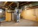 Unfinished basement with yellow-painted walls and visible pipes at 3822 Haverhill Dr, Anderson, IN 46013