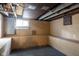 Unfinished basement with bright window and utility access at 3822 Haverhill Dr, Anderson, IN 46013