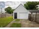 Exterior of a detached one-car garage with a door, and ample parking space at 3822 Haverhill Dr, Anderson, IN 46013