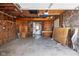 Unfinished garage space with exposed framing and concrete floor, ready for customization at 3822 Haverhill Dr, Anderson, IN 46013
