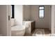 This spacious bathroom features a soaking tub, double sinks, and two windows for ample natural light at 3925 Besbie Way, Bargersville, IN 46106
