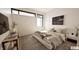 Bright bedroom with a large window, patterned rug, and modern decor at 3925 Besbie Way, Bargersville, IN 46106