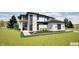 Modern two-story home with white siding, stone accents, manicured lawn, and black-framed windows at 3925 Besbie Way, Bargersville, IN 46106