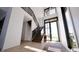 Bright foyer features a modern staircase, tall windows, and sleek finishes at 3925 Besbie Way, Bargersville, IN 46106