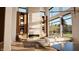 Sun-filled living room with fireplace, built-in shelves, and large windows at 3925 Besbie Way, Bargersville, IN 46106