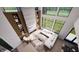 Aerial view of the stylish living room with fireplace, built-in shelves, and large windows at 3925 Besbie Way, Bargersville, IN 46106