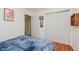 Relaxing bedroom featuring a cozy bed, closet, and hardwood floors at 4218 E 18Th St, Indianapolis, IN 46218