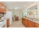 Bright kitchen showcasing ample counter space, a double sink, and wooden cabinets at 4218 E 18Th St, Indianapolis, IN 46218