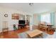 Bright living room with hardwood floors, a view into the kitchen, and a dining area at 4218 E 18Th St, Indianapolis, IN 46218