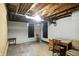 Unfinished basement space with exposed ceiling and ample room for storage or customization at 4340 Ashbourne Ln, Indianapolis, IN 46226