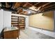 Unfinished basement with exposed beams and storage shelving, ready for customization at 4340 Ashbourne Ln, Indianapolis, IN 46226