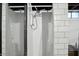 Basement bathroom featuring a clean, white tiled shower and modern fixtures at 4340 Ashbourne Ln, Indianapolis, IN 46226