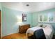 Bedroom featuring light blue walls, a dresser, and a double bed at 4340 Ashbourne Ln, Indianapolis, IN 46226