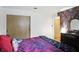 A cozy bedroom featuring light-colored walls, a large window, and a comfortable bed at 4340 Ashbourne Ln, Indianapolis, IN 46226