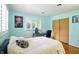 Light blue bedroom with a desk, chair, and wardrobe at 4340 Ashbourne Ln, Indianapolis, IN 46226