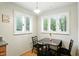 Bright dining area with plantation shutters offering plenty of natural light and an eat-in space at 4340 Ashbourne Ln, Indianapolis, IN 46226