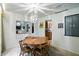 Comfortable dining room with an decorative light fixture and views to the living room and kitchen at 4340 Ashbourne Ln, Indianapolis, IN 46226