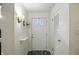 Bright entryway with white door, accent lighting, and green patterned flooring at 4340 Ashbourne Ln, Indianapolis, IN 46226
