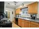 Bright kitchen showcasing wooden cabinets, modern appliances, and a window with natural light at 4340 Ashbourne Ln, Indianapolis, IN 46226