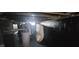 View of unfinished basement with exposed utilities and dark painted walls at 435 N Rural Ne St, Indianapolis, IN 46201