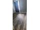 Shows a bedroom with wood look floors and a window with a curtain at 435 N Rural Ne St, Indianapolis, IN 46201
