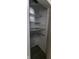A storage closet featuring built-in shelving for organized storage at 435 N Rural Ne St, Indianapolis, IN 46201