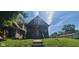Charming two-story home with a covered porch and steps leading to the entrance at 435 N Rural Ne St, Indianapolis, IN 46201