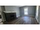 A charming living room with hardwood floors and a cozy fireplace at 435 N Rural Ne St, Indianapolis, IN 46201