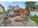 An exterior shot of backyard with an outdoor kitchen, hot tub and outdoor furniture at 4356 N College Ave, Indianapolis, IN 46205
