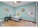 Comfortable bedroom with lots of natural light, hard wood floors and soft color palette at 4356 N College Ave, Indianapolis, IN 46205