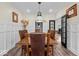 Elegant dining room featuring a large wooden table, stylish lighting, and decorative wall panels at 4356 N College Ave, Indianapolis, IN 46205