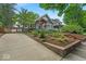 Inviting two-story house with a concrete driveway and attractive landscaping, enhancing curb appeal at 4356 N College Ave, Indianapolis, IN 46205