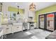 Charming kitchen with stone counters, large sink, stainless appliances and backyard view at 4356 N College Ave, Indianapolis, IN 46205