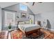 Comfortable main bedroom featuring large windows, vaulted ceilings, and stylish decor at 4356 N College Ave, Indianapolis, IN 46205