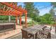 A backyard includes a patio with a hot tub, seating, and grill perfect for entertaining at 4356 N College Ave, Indianapolis, IN 46205