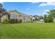 Spacious backyard with lush lawn, mature landscaping, and a private patio area at 4434 Hickory Ridge Blvd, Greenwood, IN 46143