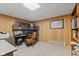 Cozy basement office featuring wood paneled walls, built in shelves, and lots of natural light at 4434 Hickory Ridge Blvd, Greenwood, IN 46143