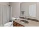 Bathroom featuring a single sink vanity and a toilet with a shower curtain at 4434 Hickory Ridge Blvd, Greenwood, IN 46143