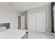 Bedroom featuring neutral walls, a window with dark curtains, and a closet with sliding doors at 4434 Hickory Ridge Blvd, Greenwood, IN 46143