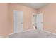 Bedroom featuring neutral-colored walls, gray carpet, and multiple white doors at 4434 Hickory Ridge Blvd, Greenwood, IN 46143