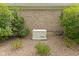A Generac backup generator installed outside a brick home surrounded by manicured landscaping at 4434 Hickory Ridge Blvd, Greenwood, IN 46143